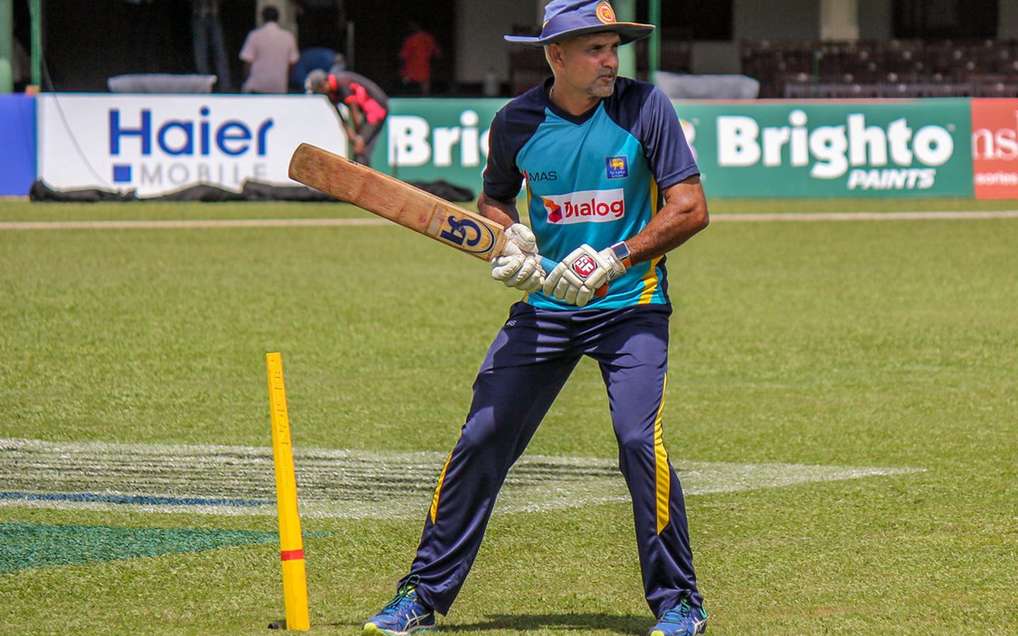 Promo photo: batter holding a cricket bat at the nets
